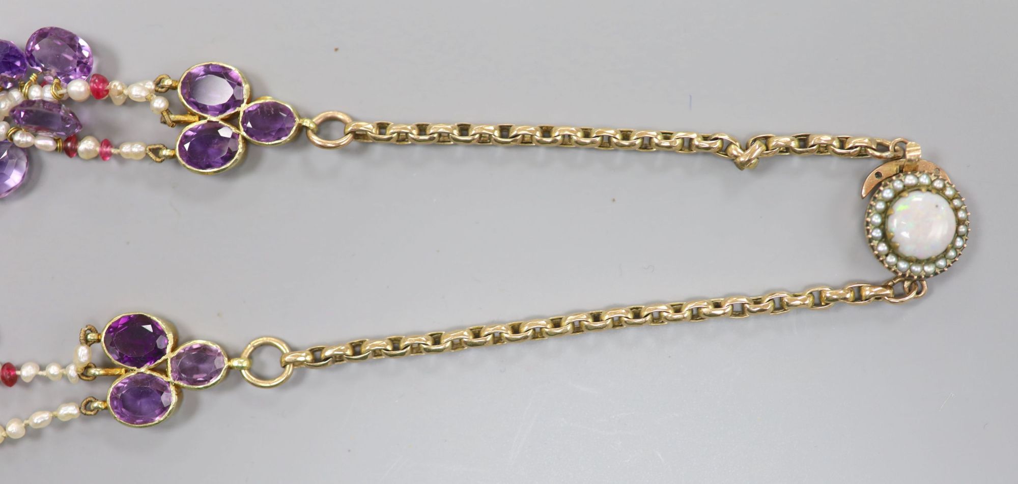 An amethyst, seed pearl and part yellow metal link necklace, with white opal set clasp(a.f.), gross weight 58 grams.